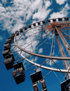 This example reduces the GIF file size by 47% at the cost of adding noise. It does not change the number of frames but only changes the transparency of pixels in different frames. It compares pixels values on a 5% similarity range and makes all pixels that fall within the given range transparent. The size of the input Ferris wheel GIF is 516KB and the size of the compressed file is 273KB. (Source: Pexels.)