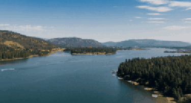 In this example, we load a GIF of drone footage of a lake and zoom in the animation to 150%, which is equivalent to resizing GIF width and height by 1.5x. The size of the original GIF is 250×135 and the size of the zoomed GIF is 375×203. We also activate the "Smooth Zoom" option to make the zoom less pixelated. (Source: Pexels.)